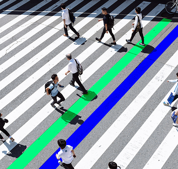 crosswalk in Japan with people walking across